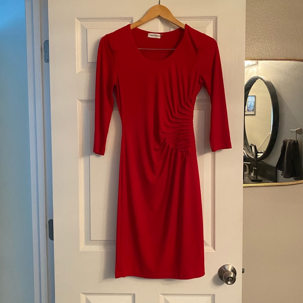Form fitting, flattering red dress with 3/4 sleeves